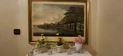 a painting on a wall with flowers in vases at Appartement Riad 5min à pied de l'aéroport in Marrakech