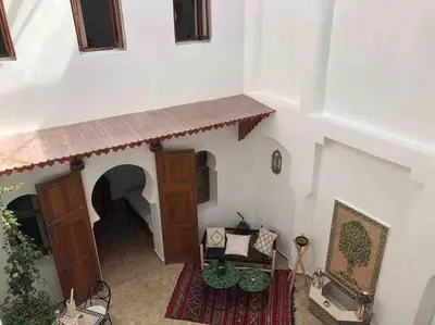 an overhead view of a building with a table and chairs at Riad Aslan Place des épices - en exclusivité, wifi in Marrakech