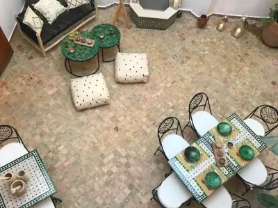 an overhead view of a living room with chairs and tables at Riad Aslan Place des épices - en exclusivité, wifi in Marrakech
