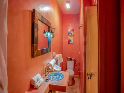 a bathroom with a sink and a toilet at Riad Nakhla in Marrakech
