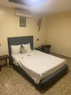 a bedroom with a large bed with white sheets at Maison coco in Marrakech