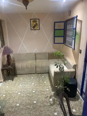 a living room with a couch and a table at Maison coco in Marrakech
