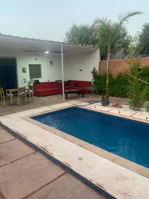 a swimming pool in the backyard of a house at Maison coco in Marrakech