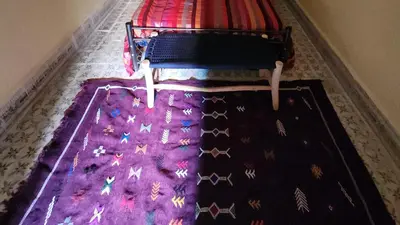 a bedroom with a bed with a purple rug with stars on it at Riad Sleeps 2 with Rooftop Views in Marrakech