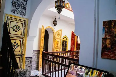 a staircase in a building with a hallway with a stair case at Riad - In Medina - Kesh Design in Marrakech