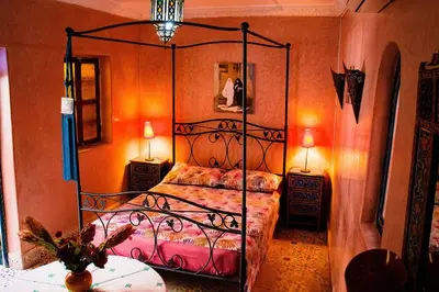 a bedroom with a metal bed in a room at Riad - In Medina - Kesh Design in Marrakech
