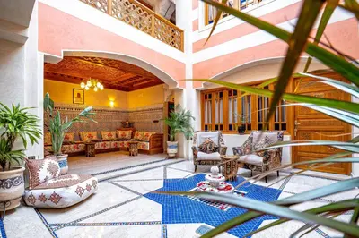 a living room with a couch and a table at Riad Brothers in Marrakech