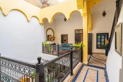 a staircase in a house with a balcony at Riad Sharqi Luminous A Sunny in Marrakech Old Town in Marrakech