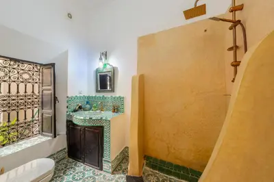 a bathroom with a sink and a shower at Riad Sharqi Luminous A Sunny in Marrakech Old Town in Marrakech