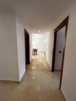 an empty hallway with a table in a room at Charmant Appartement à Gueliz in Marrakech