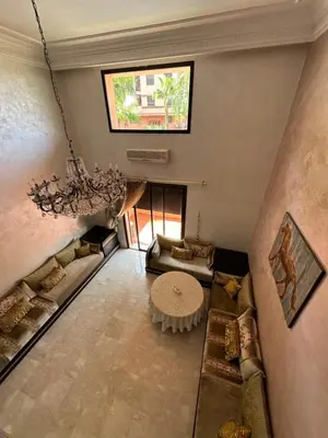 an overhead view of a living room with a chandelier at Luxury Duplex for Rent Suites,terrace,Swimimg Pool in Marrakech