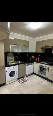a kitchen with a washer and dryer in it at Luxury Duplex for Rent Suites,terrace,Swimimg Pool in Marrakech