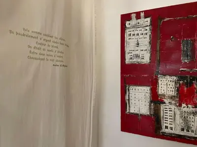 a book with a painting on the side of a wall at Dar Ibo- Entire House- in Marrakech