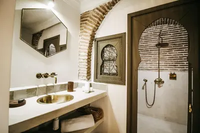 a bathroom with a sink and a shower at Riad Shabi Kasbah in Marrakech