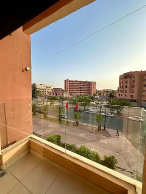 a view of a city from a window in a building at Chambre salon à avenue med 6 centre de gueliz 10 in Marrakech