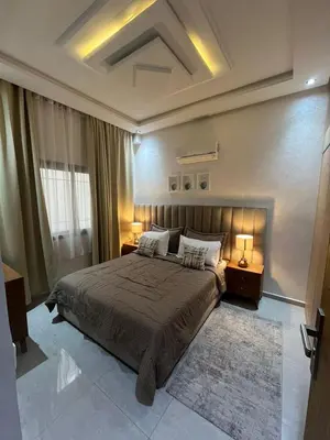 a bedroom with a large bed with two night stands at Dar Amina in Marrakech