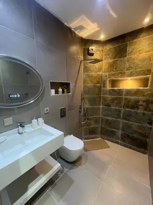a bathroom with a sink and a toilet and a shower at Dar Amina in Marrakech