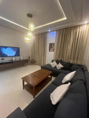 a living room with a couch and a table at Dar Amina in Marrakech