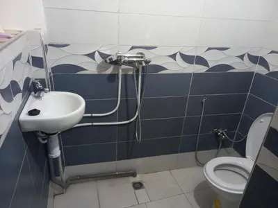 a bathroom with a sink and a toilet at Juli's in Marrakech