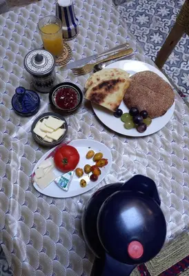 a table with two plates of food on it at Juli's in Marrakech