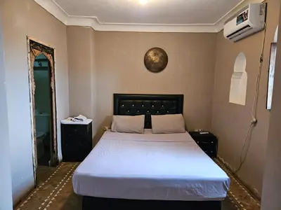 a bedroom with a large bed in a room at Guéliz Penthouse in Marrakech