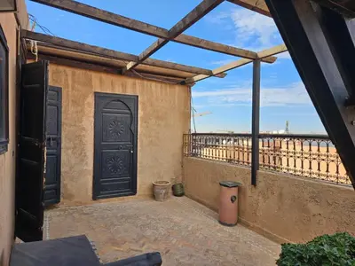 an outside view of a building with a door at Guéliz Penthouse in Marrakech