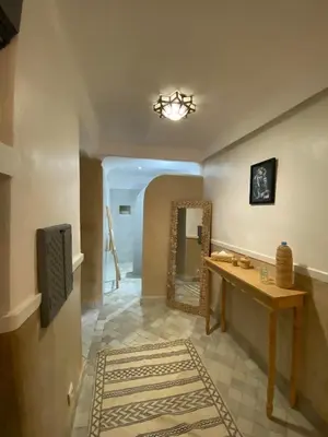 a bathroom with a vanity and a mirror and a sink at Riad DAR OMI ZAHRA in Marrakech