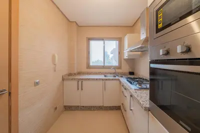 a kitchen with a sink and a stove at Relax Front of Panoraview Pool golf Atlas in Marrakech