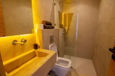 a bathroom with a sink and a toilet and a shower at Villa Piscine Privée, Petit déjeuné et ménage inclus in Marrakech