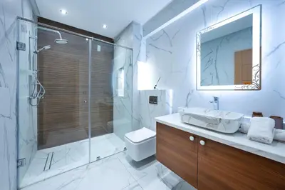a bathroom with a shower and a toilet and a sink at Bright Flat in Heart of Center in Marrakech