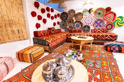 a living room with a couch and a table at Riad Sala Art Marrakech in Marrakech