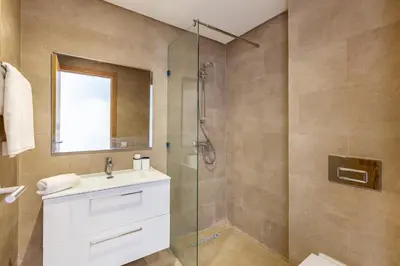 a bathroom with a sink and a shower at New! App avec Vue sur Piscine à Noria Golf in Marrakech