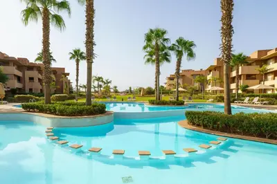 an image of a swimming pool at a resort with palm trees at Luxury XL Appart Golf View Retreat Private Garden in Marrakech