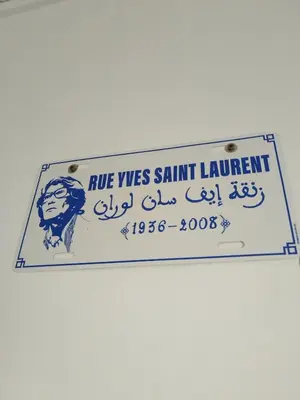 a sign that readsrue was saint laurent on a wall at Riad L'Arganier in Marrakech