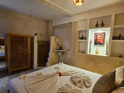 a room with a bed in a room at Riad Córdoba in Marrakech