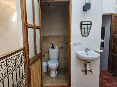 a bathroom with a toilet and a sink at Riad Córdoba in Marrakech