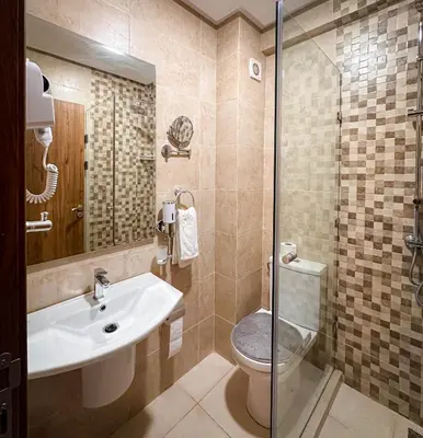 a bathroom with a sink and a toilet and a shower at Prestigieux Appartement in Marrakech