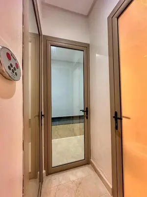 a glass door in a room with a window at villa argan golf piscine chauffée in Marrakech