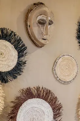 a wall with several different types of art on it at Designer Gueliz Penthouse - Terrace - Atlas Views in Marrakech