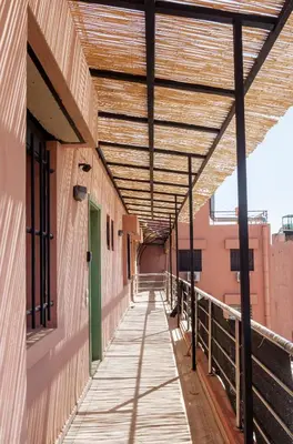 a wooden walkway with awning on a building at Designer Gueliz Penthouse - Terrace - Atlas Views in Marrakech