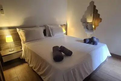 a bedroom with a bed with two slippers on it at appartement de luxe gueliz in Marrakech