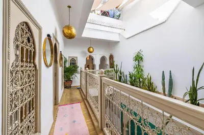 a hallway with a wrought iron gate and plants at Riad Chill&Relax Dar Tayri in Marrakech