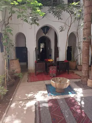 a room with a bowl in the middle of a building at Riad Dar Lalla Fatna in Marrakech