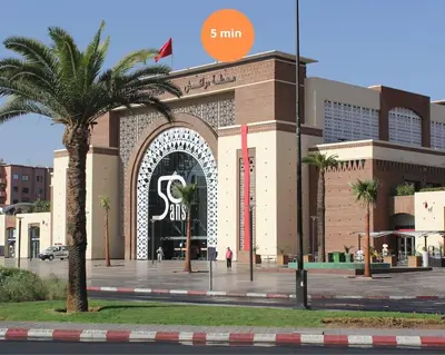 a large building with a large gate in front of it at Marrakech Reverie Downtown in Marrakech