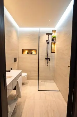 a bathroom with a shower and a sink and a toilet at Marrakech Reverie Downtown in Marrakech