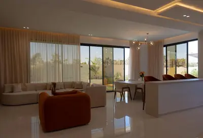 a living room with a couch and chairs and a table at Villa Volubilis - Marrakech in Marrakech