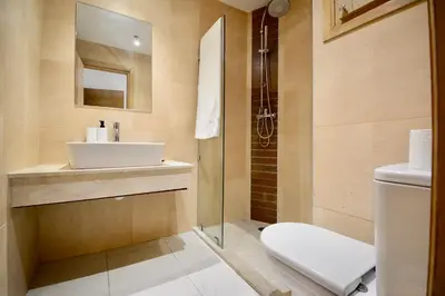 a bathroom with a sink and a toilet and a shower at Studio chic cosy au centre de l'hivernage marrakech in Marrakech