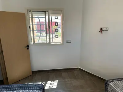 an empty room with a door and a window at Gorgeous newly renovated apt- Near Restaurant and Shopping Center in Marrakech