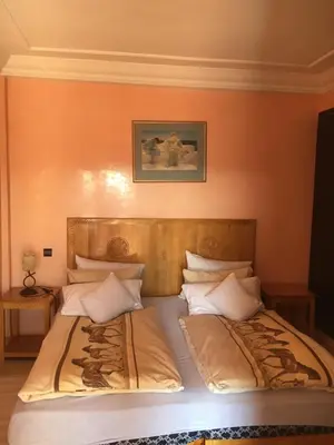 a bedroom with two twin beds with at Appartement Elias Marrakech in Marrakech