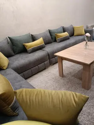 a living room with a couch and a coffee table at Oasis Appart in Marrakech